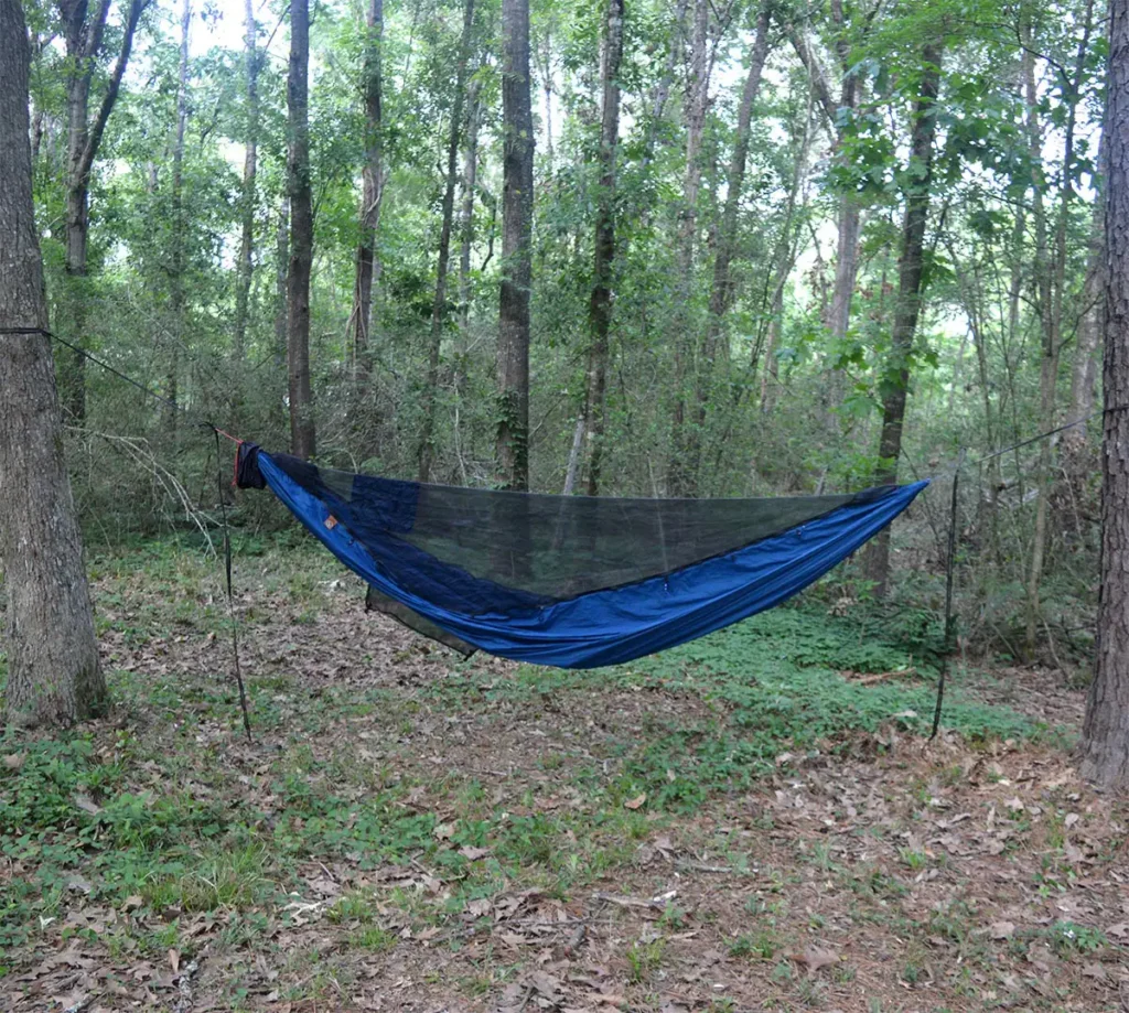 blue camping hammock with integrated bug net